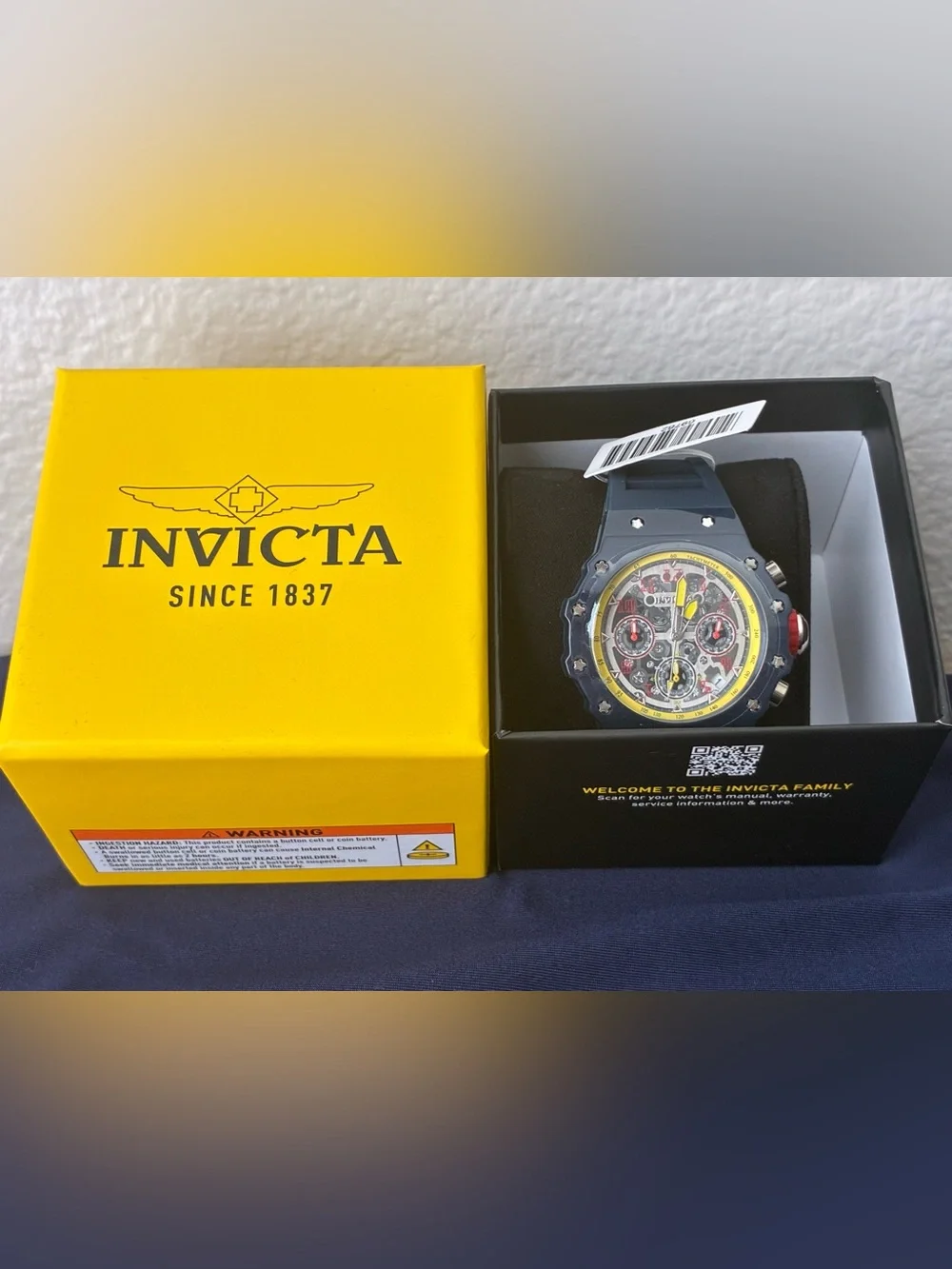 Invicta Navy Blue Watch with Yellow Accents and Red Details